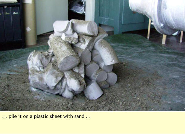 . . pile it on a plastic sheet with sand . .
