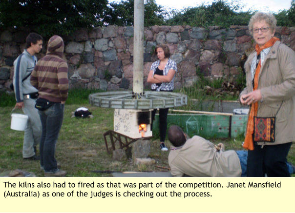 The kilns also had to fired as that was part of the competition. Janet Mansfield (Australia) as one of the judges is checking out the process.